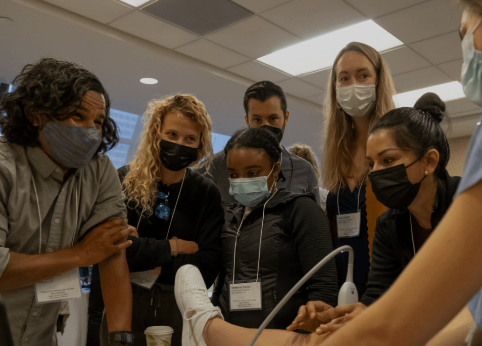 A diverse group of individuals wearing masks and gloves, standing together in a public space, promoting health safety.